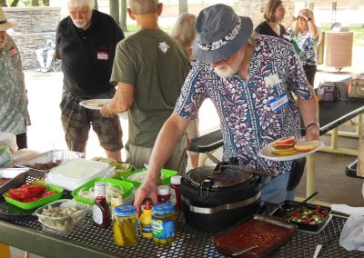 Gary loading up a hamburger