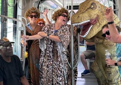 Edwin Armer dressed as a T-Rex in cowboy boots