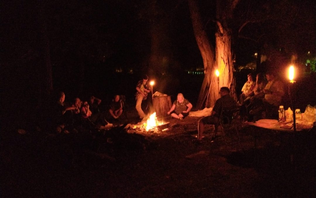 MAM members, family & friends gathering around a bonfire