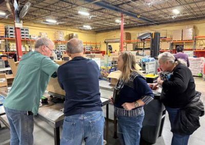 Volunteers helping out at Harvesters Mensa event